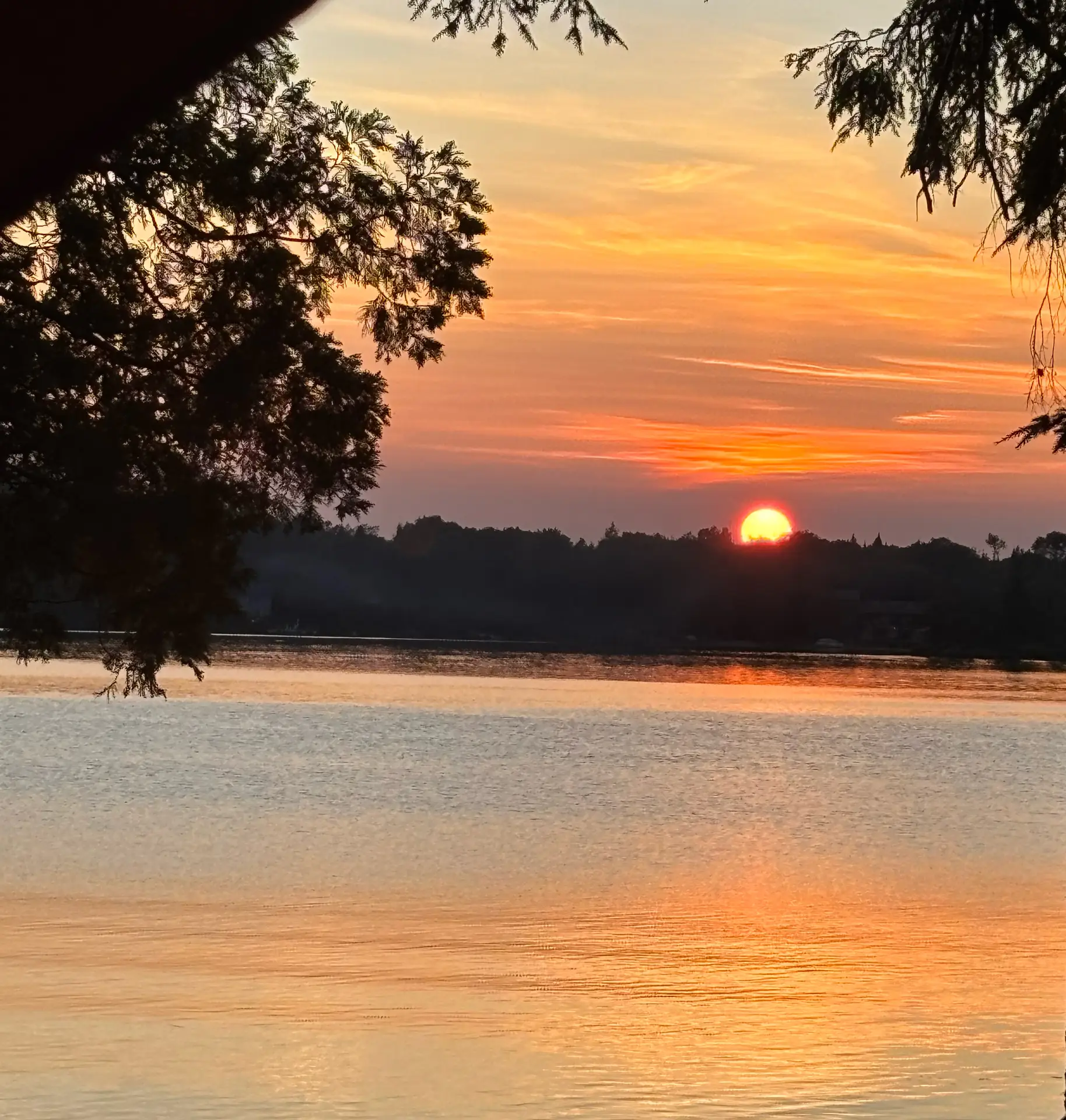 Sunset views from the cottage and the deck and dock