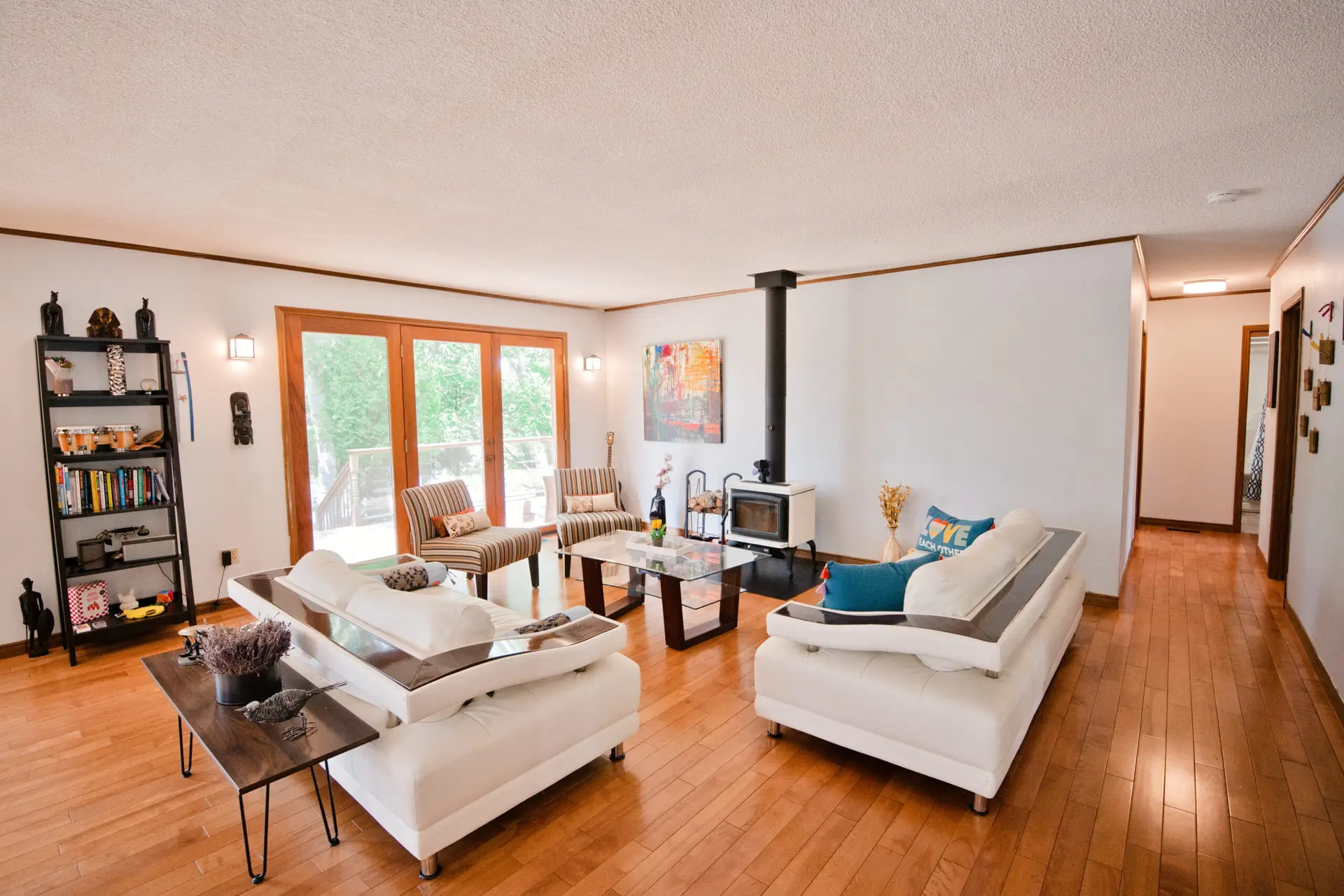 Open concept living room with wood burning fireplace